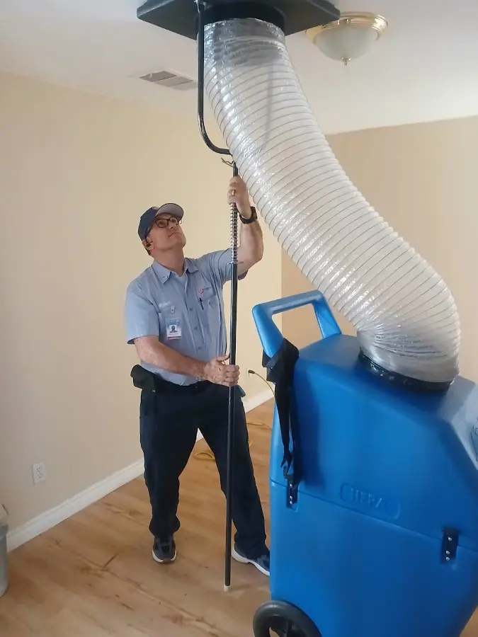 Furnace Tune-Up technician using HEPA equipment in Sacramento